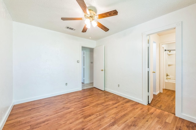 2425 Dancy Dr N, Fort Worth, TX 76131 - unfurnished bedroom featuring light wood-type flooring, baseboards, and a ceiling fan