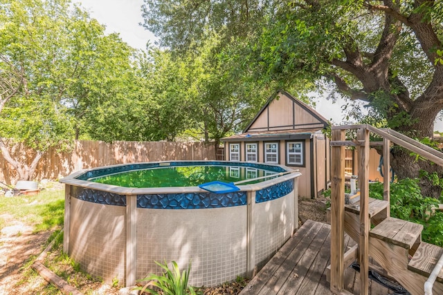 2425 Dancy Dr N, Fort Worth, TX 76131 - view of pool featuring a fenced backyard and an outbuilding