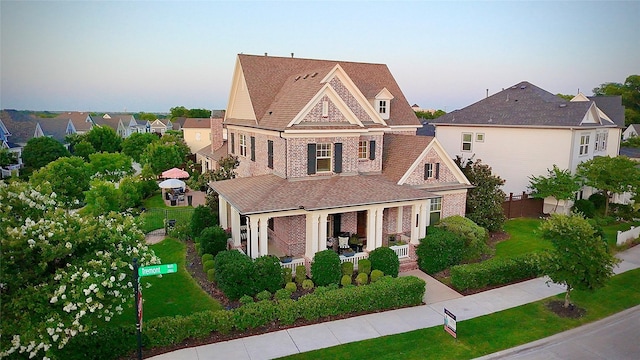 2116 Tremont Blvd, Mckinney, TX 75071 - view of front of house with a residential view, brick siding, and a shingled roof