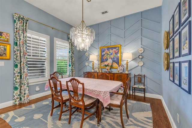 2116 Tremont Blvd, Mckinney, TX 75071 - dining room featuring wood finished floors and a chandelier
