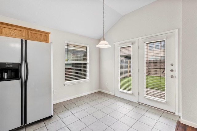 13209 Fencerow Rd, Fort Worth, TX 76244 - unfurnished dining area featuring vaulted ceiling, baseboards, and light tile patterned floors