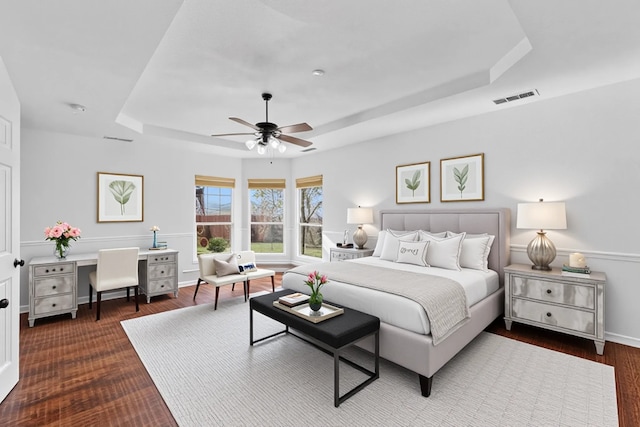 3436 Copper Point Ln, Frisco, TX 75034 - bedroom featuring a raised ceiling, wood finished floors, baseboards, an office area, and ceiling fan