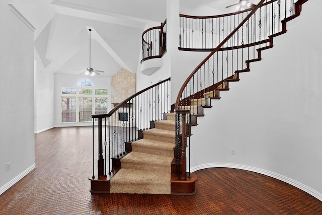 3436 Copper Point Ln, Frisco, TX 75034 - stairway featuring ceiling fan, a high ceiling, carpet flooring, and baseboards