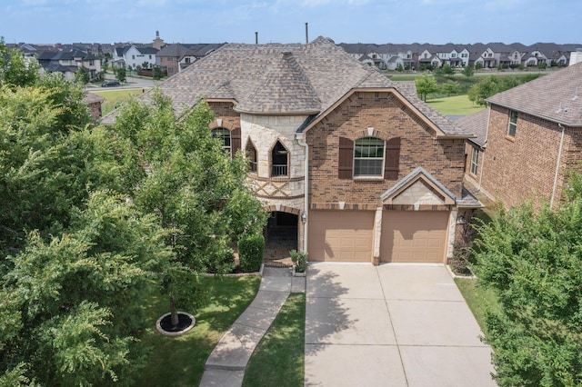 3436 Copper Point Ln, Frisco, TX 75034 - french provincial home featuring a residential view, roof with shingles, brick siding, and concrete driveway