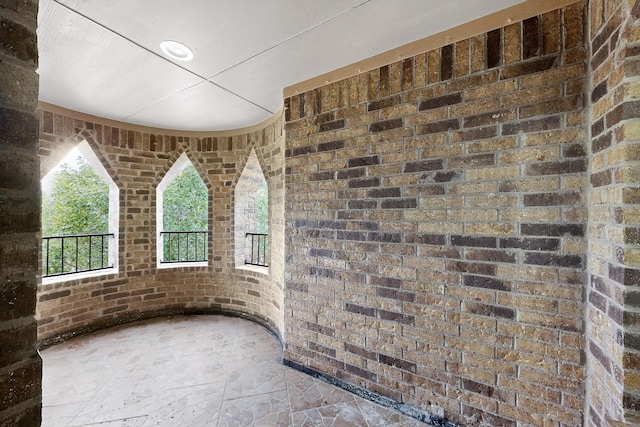 3436 Copper Point Ln, Frisco, TX 75034 - interior space featuring brick wall and stone finish floors