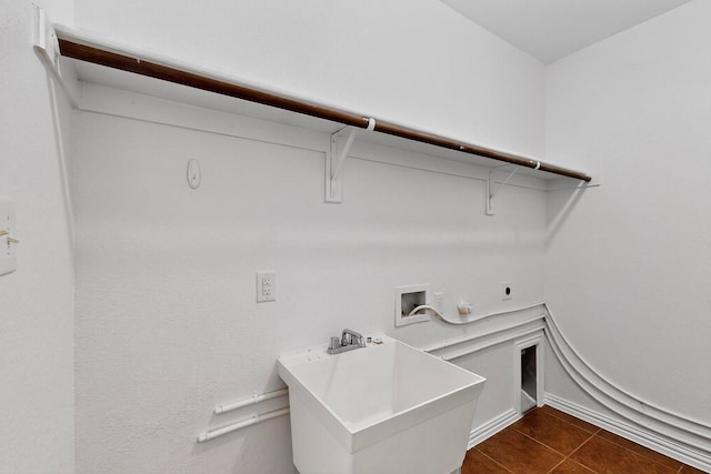 3436 Copper Point Ln, Frisco, TX 75034 - laundry area featuring hookup for an electric dryer, washer hookup, hookup for a gas dryer, and dark tile patterned floors