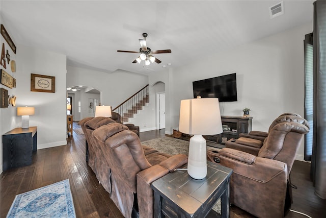 1925 Knoxbridge Rd, Forney, TX 75126 - living area featuring arched walkways, ceiling fan, stairs, and hardwood / wood-style flooring
