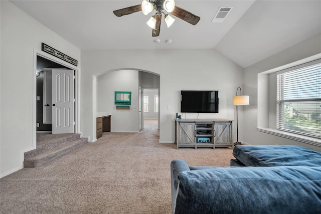 1925 Knoxbridge Rd, Forney, TX 75126 - carpeted living area featuring arched walkways, ceiling fan, vaulted ceiling, and baseboards
