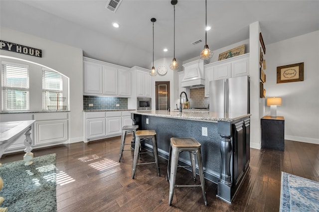 1925 Knoxbridge Rd, Forney, TX 75126 - kitchen featuring stainless steel appliances, dark wood finished floors, white cabinets, tasteful backsplash, and lofted ceiling