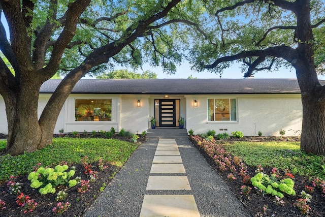 4336 Irvin Simmons Dr, Dallas, TX 75229 - mid-century modern home with brick siding and roof with shingles