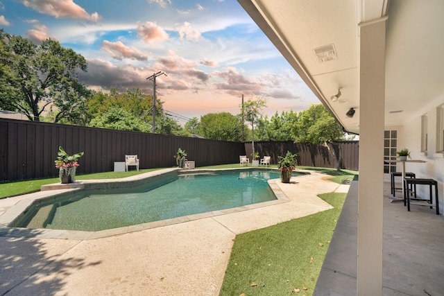 4336 Irvin Simmons Dr, Dallas, TX 75229 - pool at dusk featuring a patio area and a fenced backyard