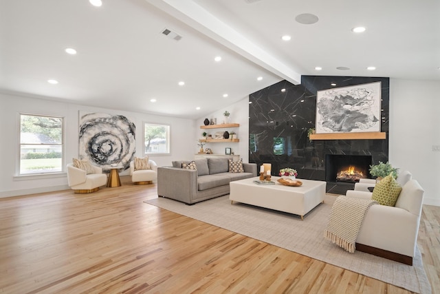 4336 Irvin Simmons Dr, Dallas, TX 75229 - living room with wood finished floors, a premium fireplace, and recessed lighting