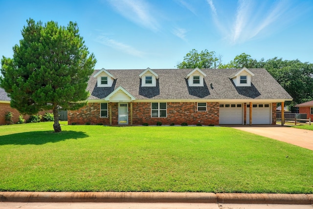 2050 Greenbriar Dr, Abilene, TX 79605 - cape cod home featuring a garage, driveway, brick siding, and roof with shingles