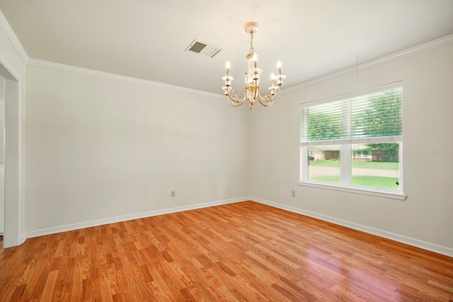 2050 Greenbriar Dr, Abilene, TX 79605 - spare room featuring a chandelier, light wood finished floors, ornamental molding, and baseboards