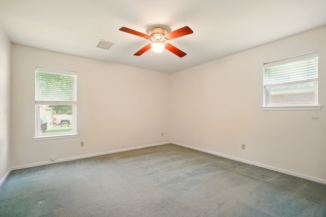 2050 Greenbriar Dr, Abilene, TX 79605 - empty room featuring a ceiling fan, plenty of natural light, and carpet
