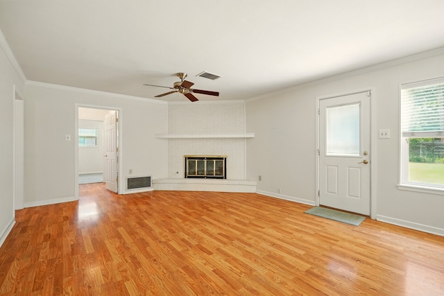 2050 Greenbriar Dr, Abilene, TX 79605 - unfurnished living room with light wood-style flooring, crown molding, a ceiling fan, and baseboards