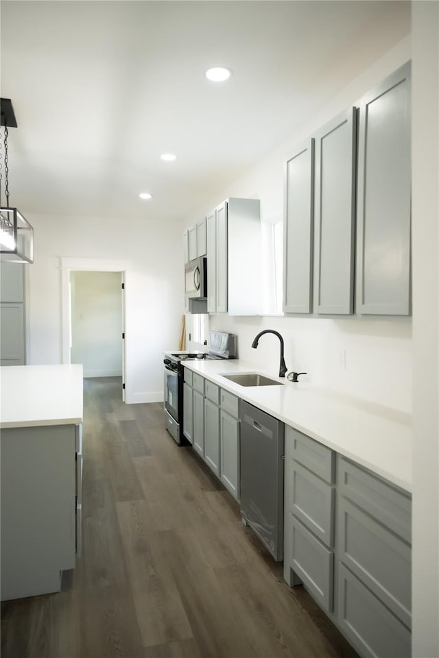 309 E Cheek St, Saint Jo, TX 76265 - kitchen with stainless steel appliances, a sink, gray cabinets, recessed lighting, and light countertops