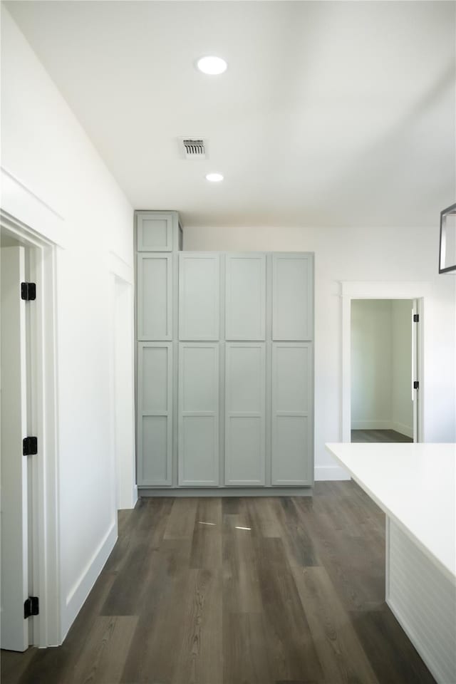 309 E Cheek St, Saint Jo, TX 76265 - corridor with dark wood-style floors, baseboards, and recessed lighting