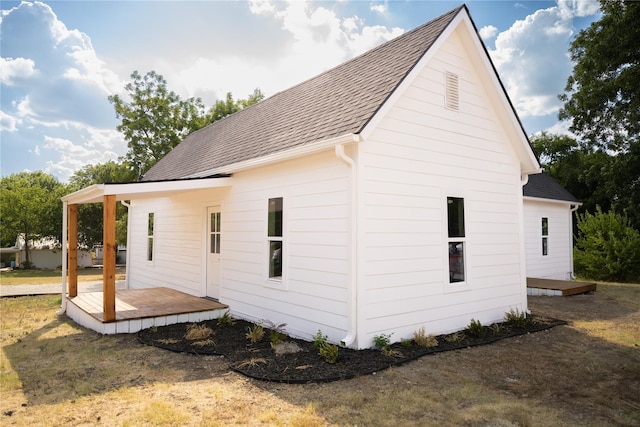 309 E Cheek St, Saint Jo, TX 76265 - rear view of property with a shingled roof