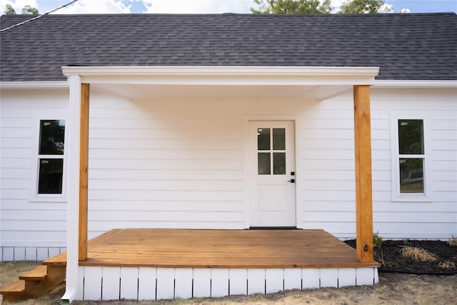 309 E Cheek St, Saint Jo, TX 76265 - entrance to property featuring roof with shingles and a wooden deck