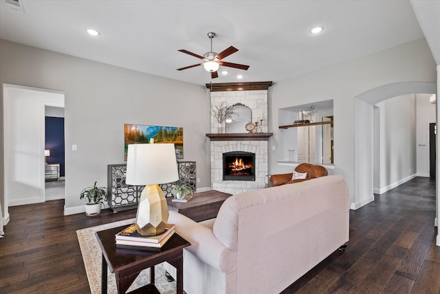 350 Lake Trail Ln, Prosper, TX 75078 - living room featuring arched walkways, a ceiling fan, a stone fireplace, wood finished floors, and recessed lighting