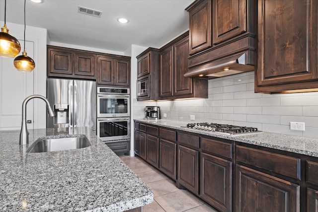 350 Lake Trail Ln, Prosper, TX 75078 - kitchen featuring stainless steel appliances, a sink, decorative backsplash, light stone countertops, and recessed lighting