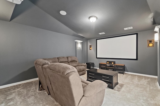 350 Lake Trail Ln, Prosper, TX 75078 - home theater with light carpet, baseboards, vaulted ceiling, and a textured ceiling