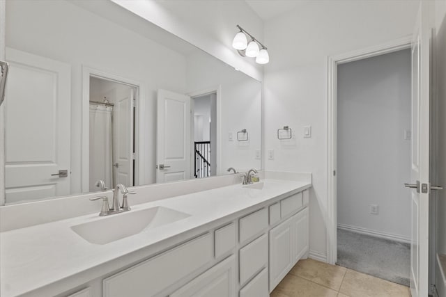 350 Lake Trail Ln, Prosper, TX 75078 - bathroom with double vanity, tile patterned floors, and baseboards