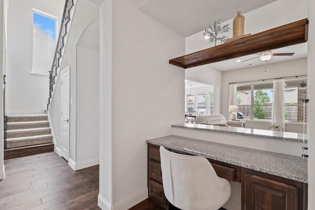 350 Lake Trail Ln, Prosper, TX 75078 - bar featuring baseboards, stairway, dark wood-style floors, and ceiling fan