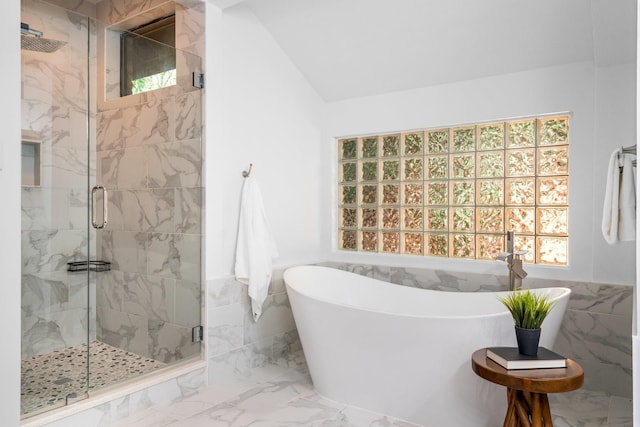 5325 Seascape Ln, Plano, TX 75093 - full bathroom with healthy amount of natural light, a freestanding bath, tile walls, a marble finish shower, and marble finish flooring