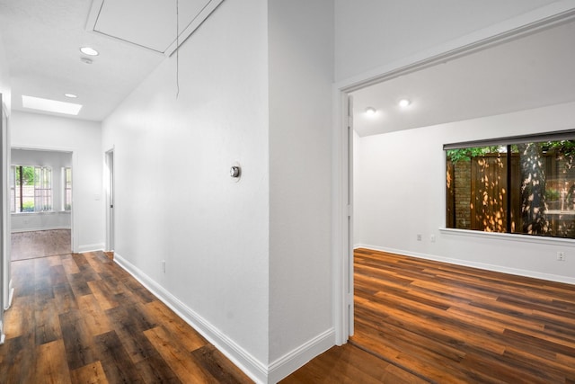 5325 Seascape Ln, Plano, TX 75093 - corridor featuring wood finished floors, baseboards, recessed lighting, and attic access