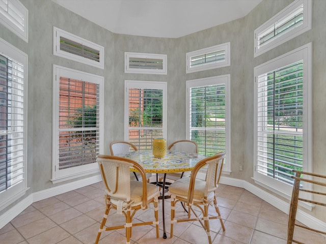 6321 Fershaw Pl, Fort Worth, TX 76116 - dining room featuring light tile patterned flooring, baseboards, plenty of natural light, and a towering ceiling