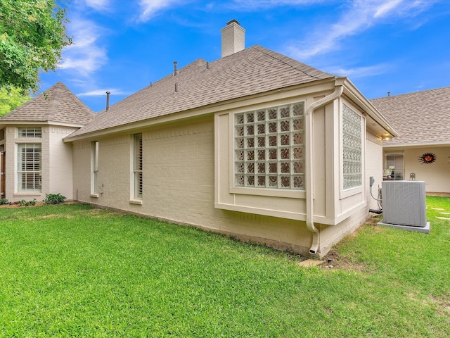 6321 Fershaw Pl, Fort Worth, TX 76116 - view of property exterior with roof with shingles, a yard, a chimney, and central AC unit