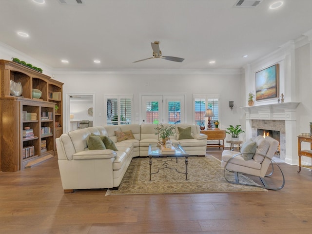 6321 Fershaw Pl, Fort Worth, TX 76116 - living room featuring ornamental molding, ceiling fan, wood finished floors, a warm lit fireplace, and recessed lighting