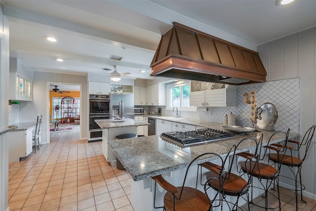4141 Shannon Dr, Fort Worth, TX 76116 - kitchen featuring appliances with stainless steel finishes, a sink, ceiling fan, custom range hood, and decorative backsplash