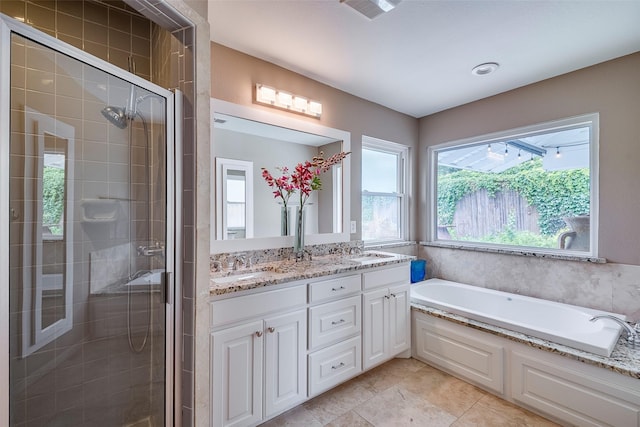 4141 Shannon Dr, Fort Worth, TX 76116 - full bathroom featuring double vanity, a shower stall, a garden tub, and tile patterned flooring