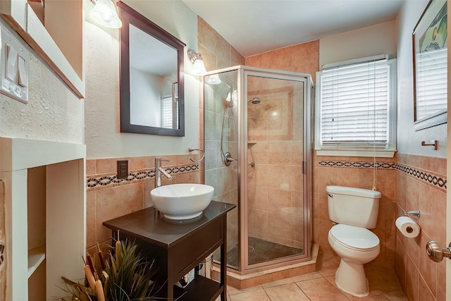 4141 Shannon Dr, Fort Worth, TX 76116 - bathroom with tile walls, tile patterned flooring, toilet, a stall shower, and vanity
