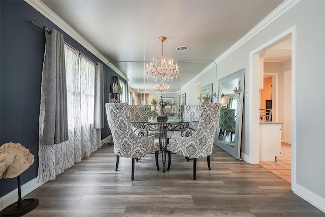 4141 Shannon Dr, Fort Worth, TX 76116 - dining space with a chandelier, ornamental molding, baseboards, and wood finished floors