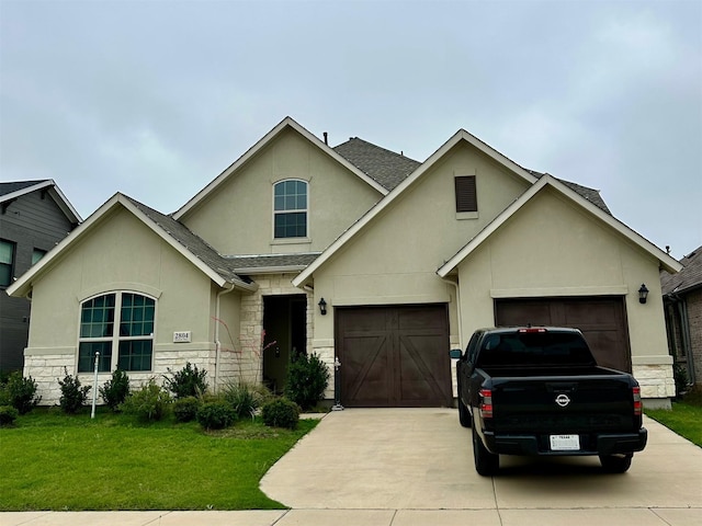 2804 Walker Way, Northlake, TX 76247 - traditional-style house with stone siding, concrete driveway, stucco siding, a front yard, and an attached garage