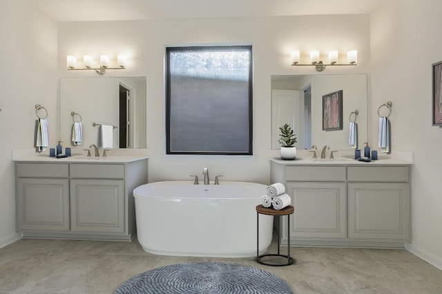 2804 Walker Way, Northlake, TX 76247 - bathroom with two vanities, a soaking tub, and baseboards