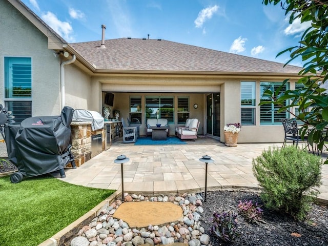9813 Ironwood Dr, Denton, TX 76207 - rear view of property with stucco siding, an outdoor kitchen, a patio area, an outdoor hangout area, and roof with shingles