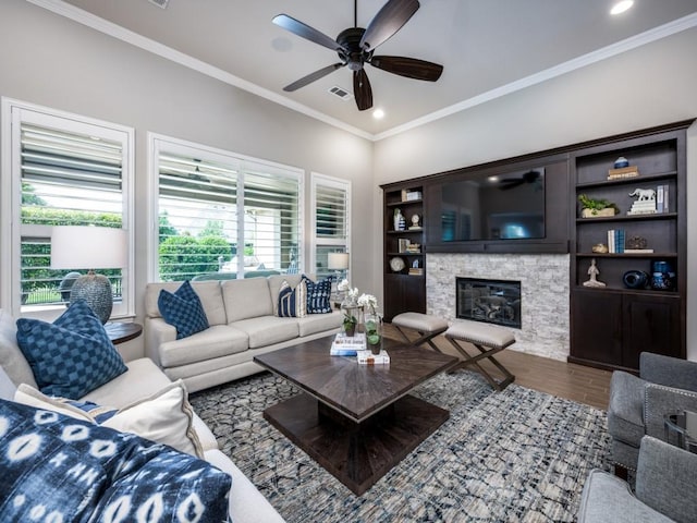 9813 Ironwood Dr, Denton, TX 76207 - living room featuring ceiling fan, wood finished floors, crown molding, a stone fireplace, and recessed lighting