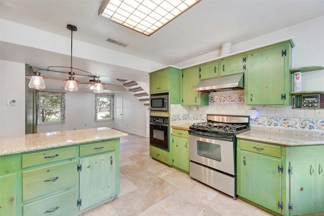 4 Waterview Pl, Richardson, TX 75080 - kitchen with appliances with stainless steel finishes, under cabinet range hood, light countertops, and decorative backsplash