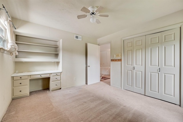 4 Waterview Pl, Richardson, TX 75080 - unfurnished bedroom featuring light carpet, a desk, ceiling fan, a closet, and baseboards