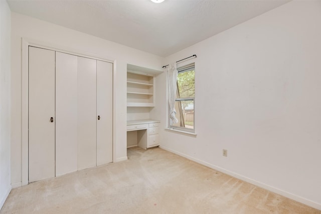 4 Waterview Pl, Richardson, TX 75080 - unfurnished bedroom featuring light carpet, baseboards, and a closet
