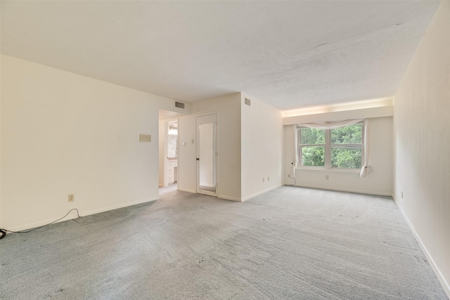 4 Waterview Pl, Richardson, TX 75080 - spare room featuring light colored carpet and baseboards