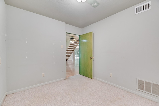 4 Waterview Pl, Richardson, TX 75080 - unfurnished room with carpet flooring, baseboards, stairs, and ceiling fan