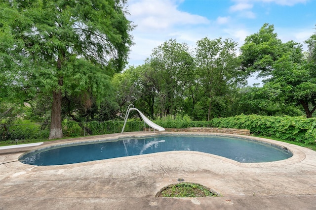 4 Waterview Pl, Richardson, TX 75080 - view of pool with a water slide, a diving board, and a patio