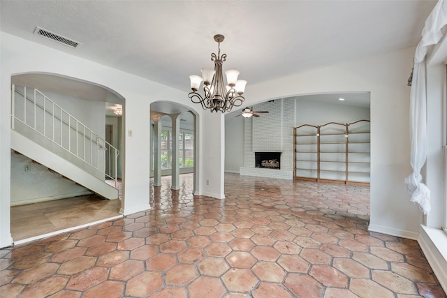 4 Waterview Pl, Richardson, TX 75080 - unfurnished living room featuring arched walkways, a brick fireplace, a chandelier, ceiling fan, and recessed lighting