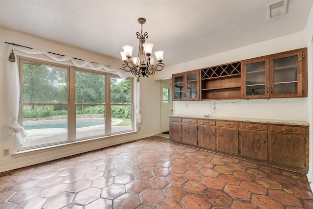 4 Waterview Pl, Richardson, TX 75080 - unfurnished dining area with a chandelier